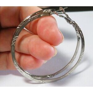 2 pairs of large silver tone Hoop earrings ! Each pair has different pattern!